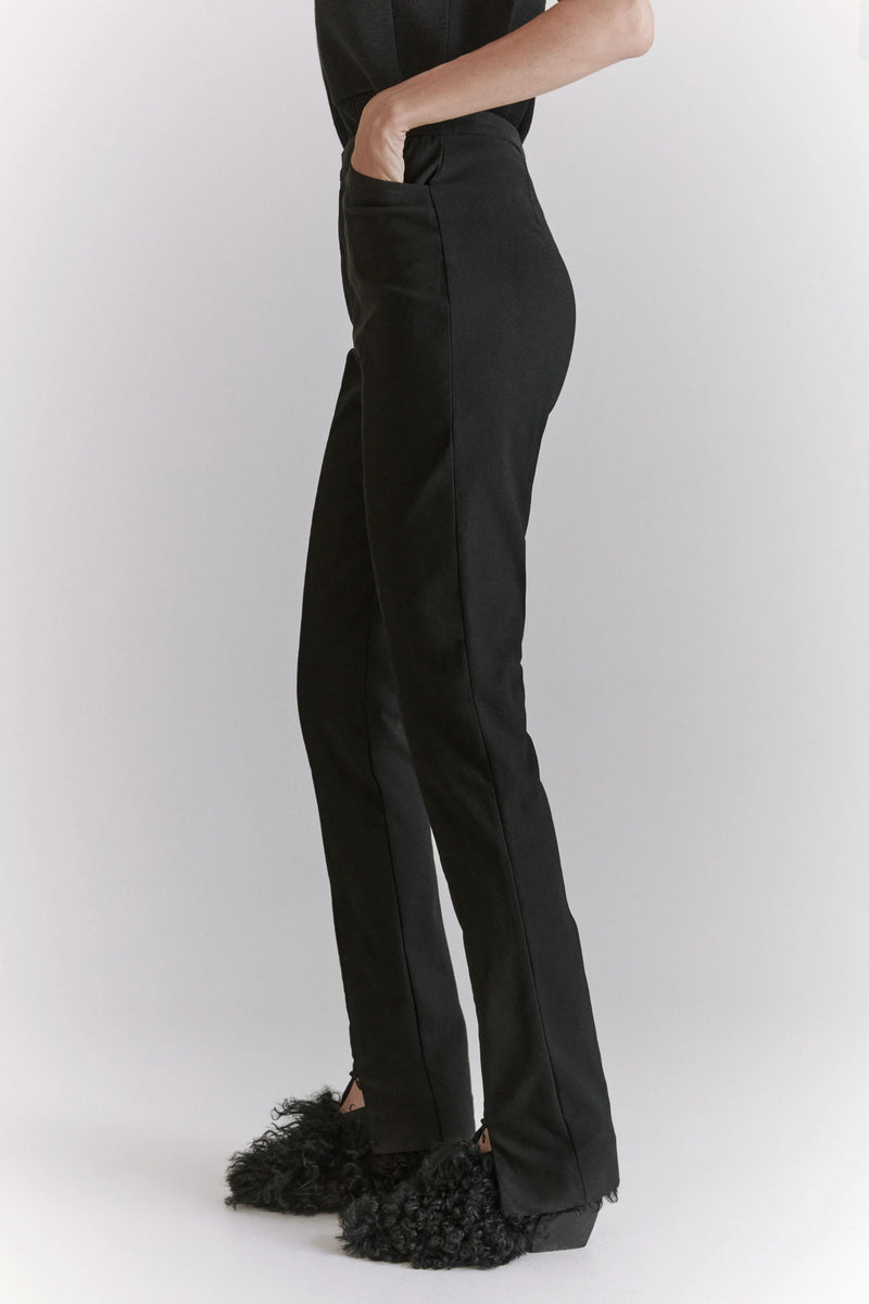 Black Steady Trousers by HOPE on Sale